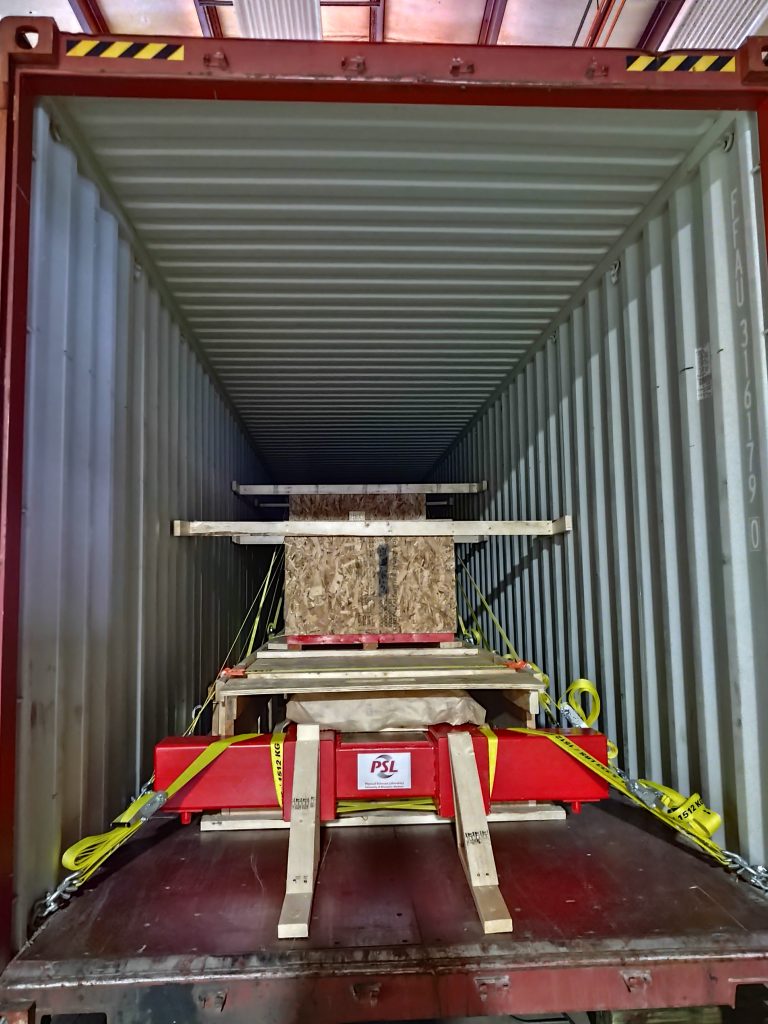 DUNE APA being shipped in a metal cargo container. The APA is sideways on top of shipping materials.