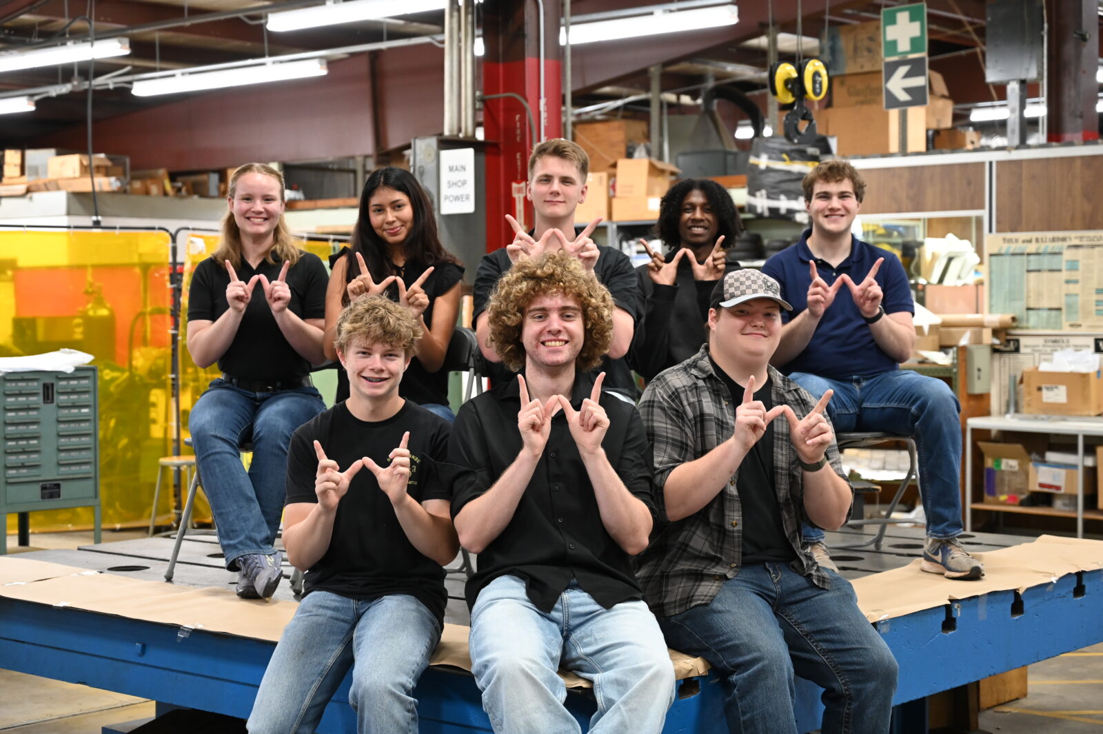 Interns doing W's with hands.